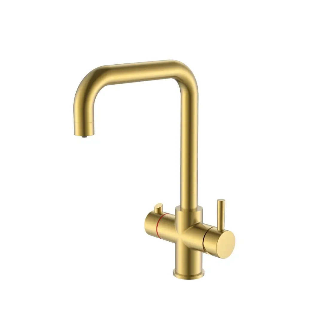 a gold faucet with a red handle